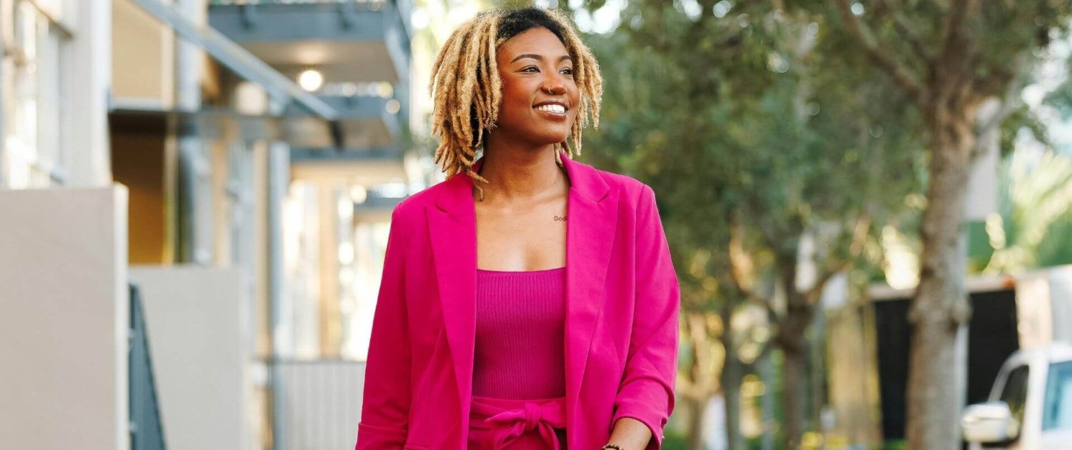 Woman walking confidently - own your story without apologizing