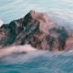 single rock in flowing water depicting courage to belong to yourself