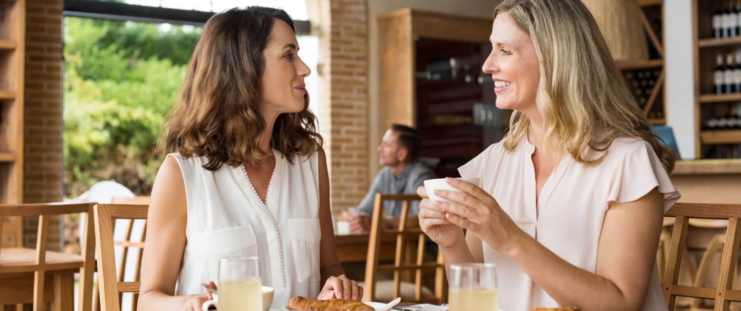 renewing frienships two women renewing friendship over coffee
